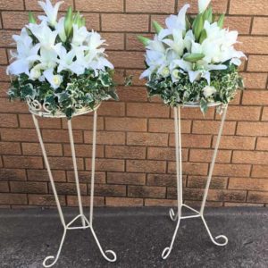 small flower arrangements with iron stands